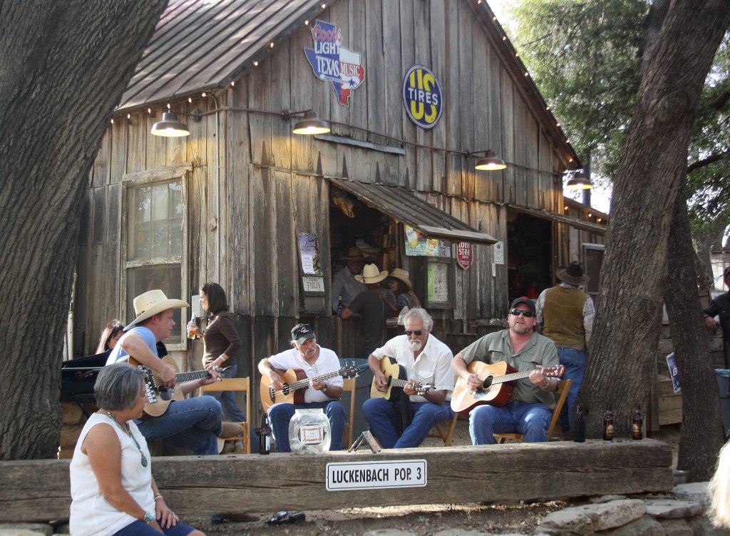 Guests of the bar in Luckenbach play guitars under some trees in Luckenbach (Texas), USA, 19 March 2013. German is spoken in the middle of Texas. Descendants of German settlers meet at the bar every evening. They speak their German-English dialect to save it from extinction. Photo: Christina Horsten /dpa | usage worldwide