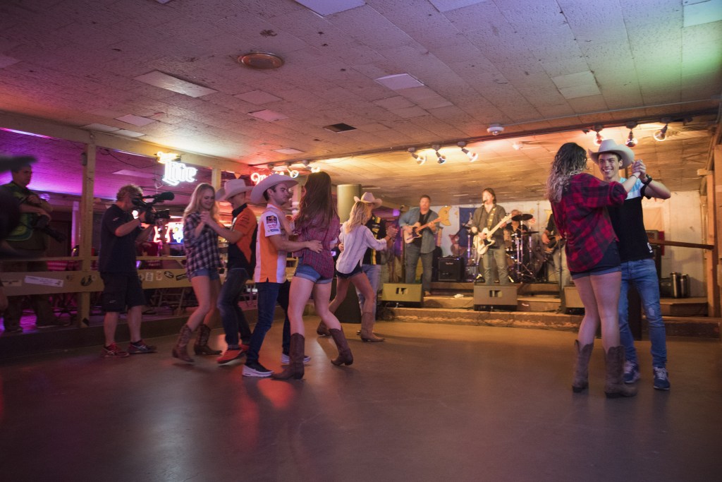 Joan Mir of Spain and Leopard Racing, Thomas Luthi of Switzerland and Carxpert Interwetten, Dani Pedrosa of Spain and Repsol Honda Team and Pol Espargaro of Spain and Red Bull KTM Factory Racing dance with the girls during the pre-event "Riders have a private and exciting dance lesson in Broken Spoke Dance Hall in Austin" during the MotoGp Red Bull U.S. Grand Prix of The Americas - Previews at Circuit of The Americas on April 20, 2017 in Austin, Texas.