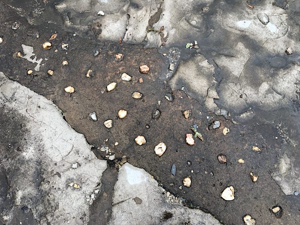 The uniquely placed colorful rocks and quartz crystals can still be found throughout the grounds.