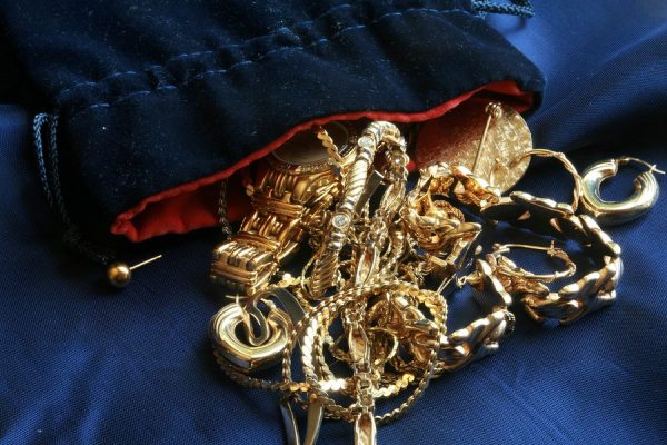 Old Gold jewelry on Blue Silk