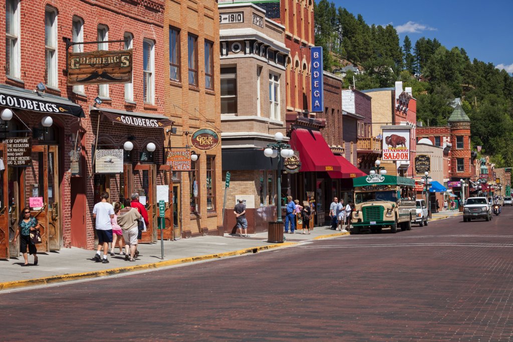 Tourist explore Main Street in historic Deadwood, South Dakota.