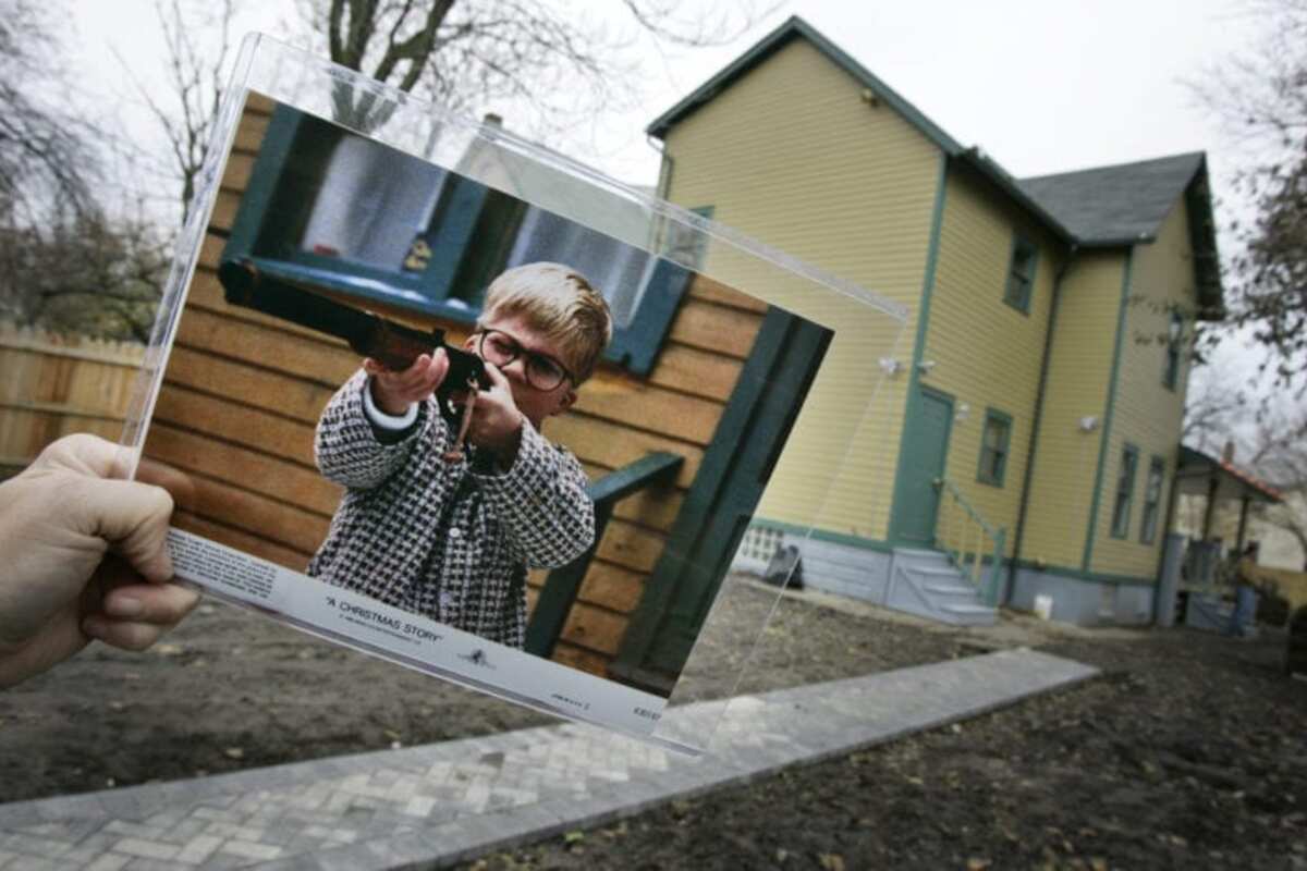 A photo of the character Ralphie, played by actor Peter Billigsley,  firing his Red Ryder air rifle from the classic movie 'A Christmas Story'  is seen in the back yard of the house used in the filming of the movie in Cleveland, Monday, Nov. 13, 2006.  Brian Jones, who had started a business selling the leg lamp made famous in the film, has bought the house and has renovated it as a museum. 