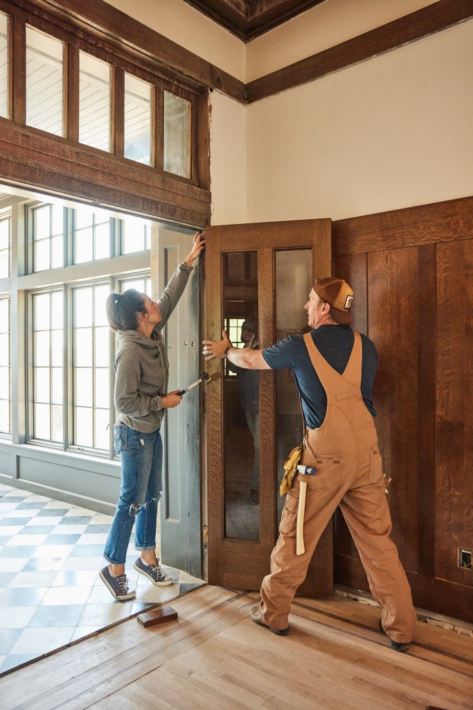 Hosts Chip and Joanna Gaines, as seen on Fixer Upper: The Castle. Hosts Chip and Joanna Gaines install doors, outdoor awnings, as seen on Fixer Upper: The Castle.