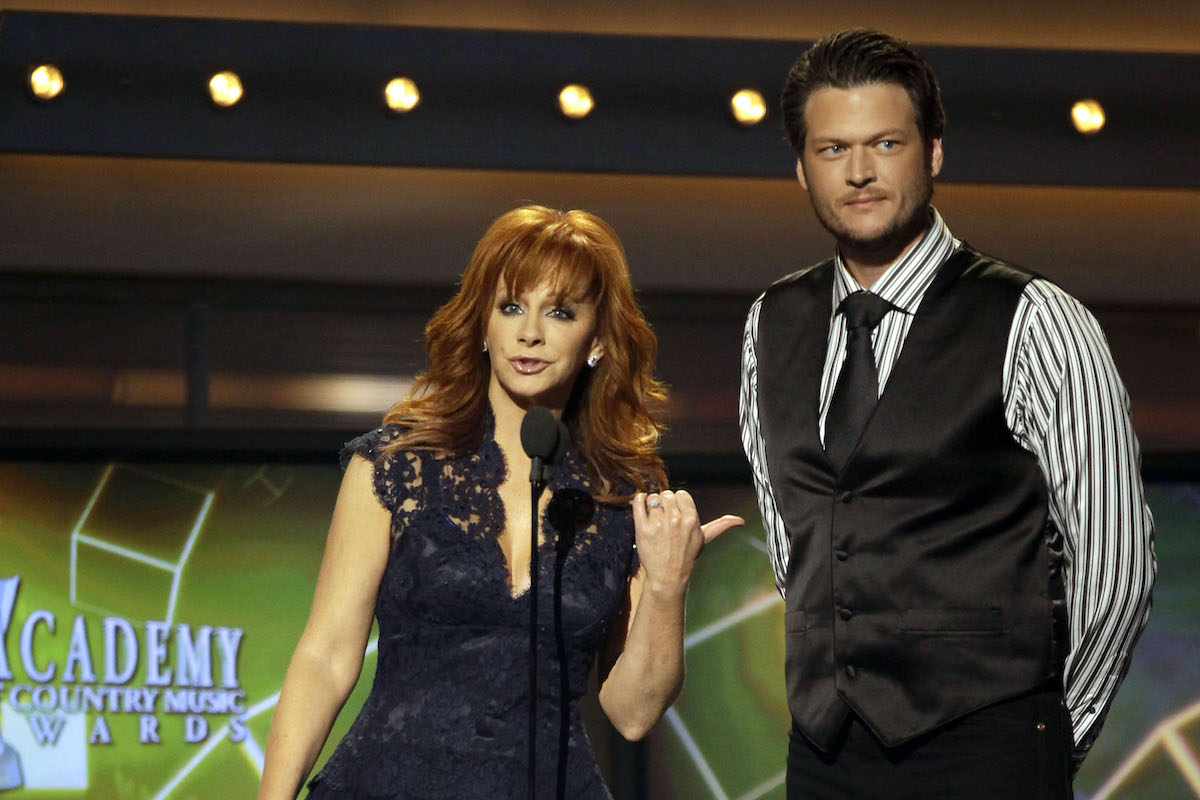 FILE - This April 3, 2011 file photo shows hosts Reba McEntire, left, and Blake Shelton onstage at the 46th Annual Academy of Country Music Awards in Las Vegas. McEntire is ending her run as host of the Academy of Country Music Awards. Sheís stepping aside after a record 14 appearances, the last two with co-host Blake Shelton, who will return on the 2013 edition of the awards show.