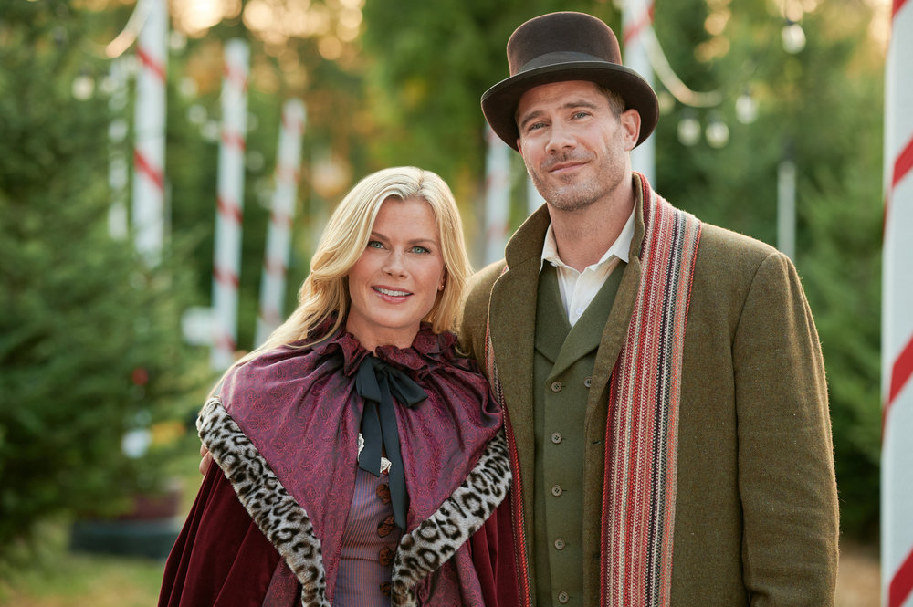 When Summer's mother Vivian moves in with her and her young daughter Chloe, her orderly existence is upended. Upon arrival, Vivian sets up an heirloom, miniature Christmas village resembling their town, and tells Chloe it grants Christmas wishes. As Chloe begins setting up the figurines, real-life events seem to mimic the scenes she creates. Photo: Alison Sweeney, Luke Macfarlane