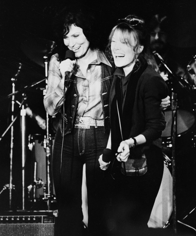 Country music singer Loretta Lynn, left, and actress Sissy Spacek, who portrays Lynn in the movie "Coal Miner's Daughter," join in a duet during a party to launch the national release of the film in Los Angeles, Ca., in 1980.