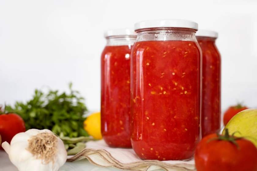 Canned tomato sauce, prepared at home.Harvesting for the winter.