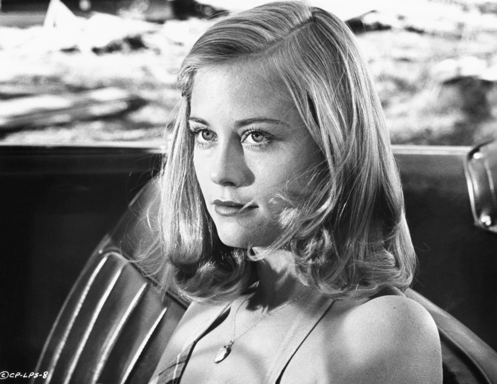 Jacy Farrow (Cybill Shepherd) sits in the driver's seat of a car in a scene from the 1971 film The Last Picture Show.