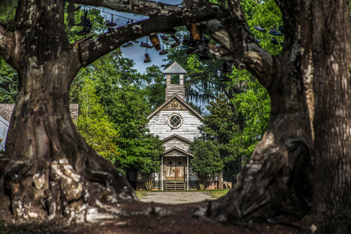 A landscape image of an abandoned town in Alabama. The small town was designed as a movie set for the fictional town of Spectre, the setting for the movie Big Fish.