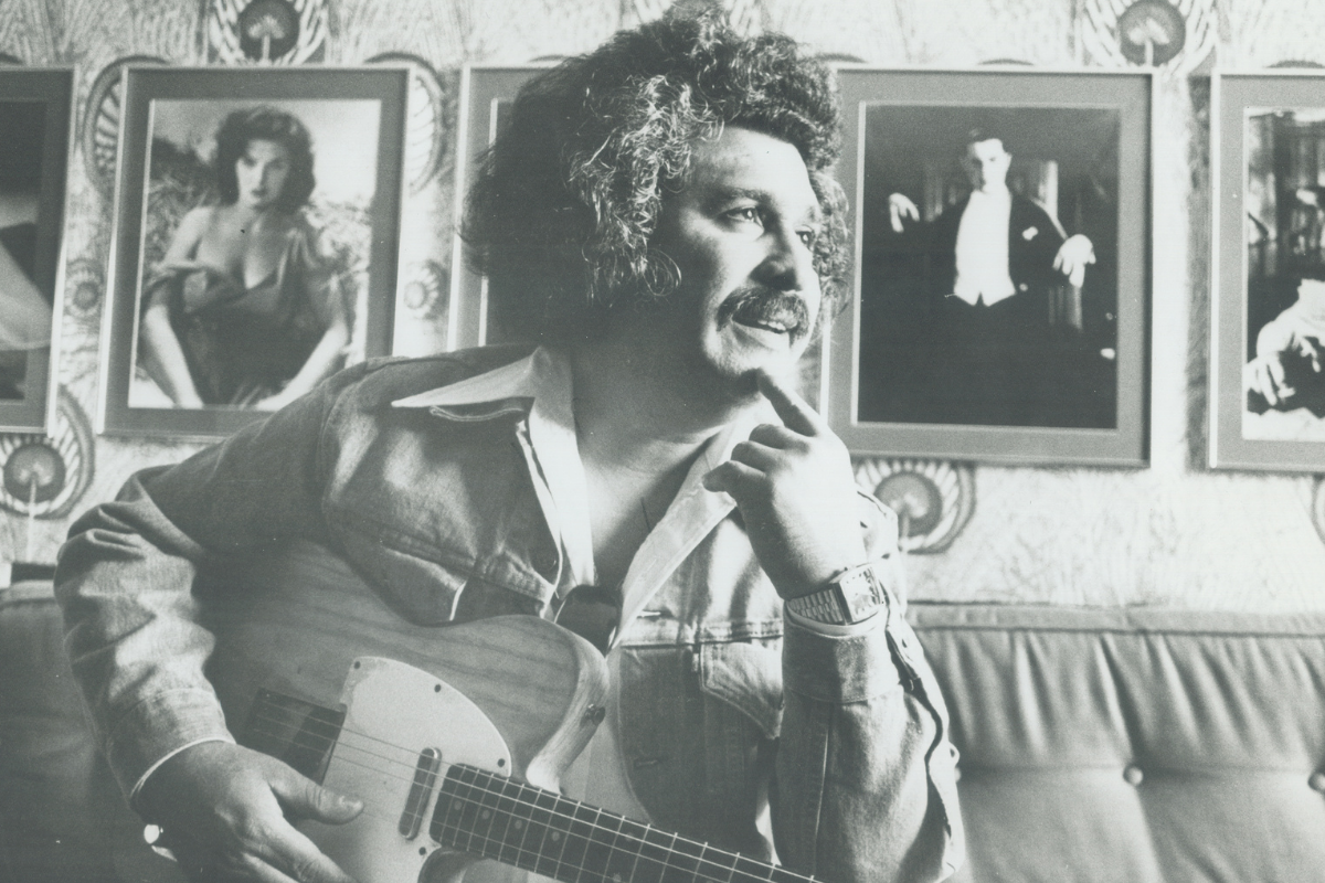 Freddy Fender poses backstage