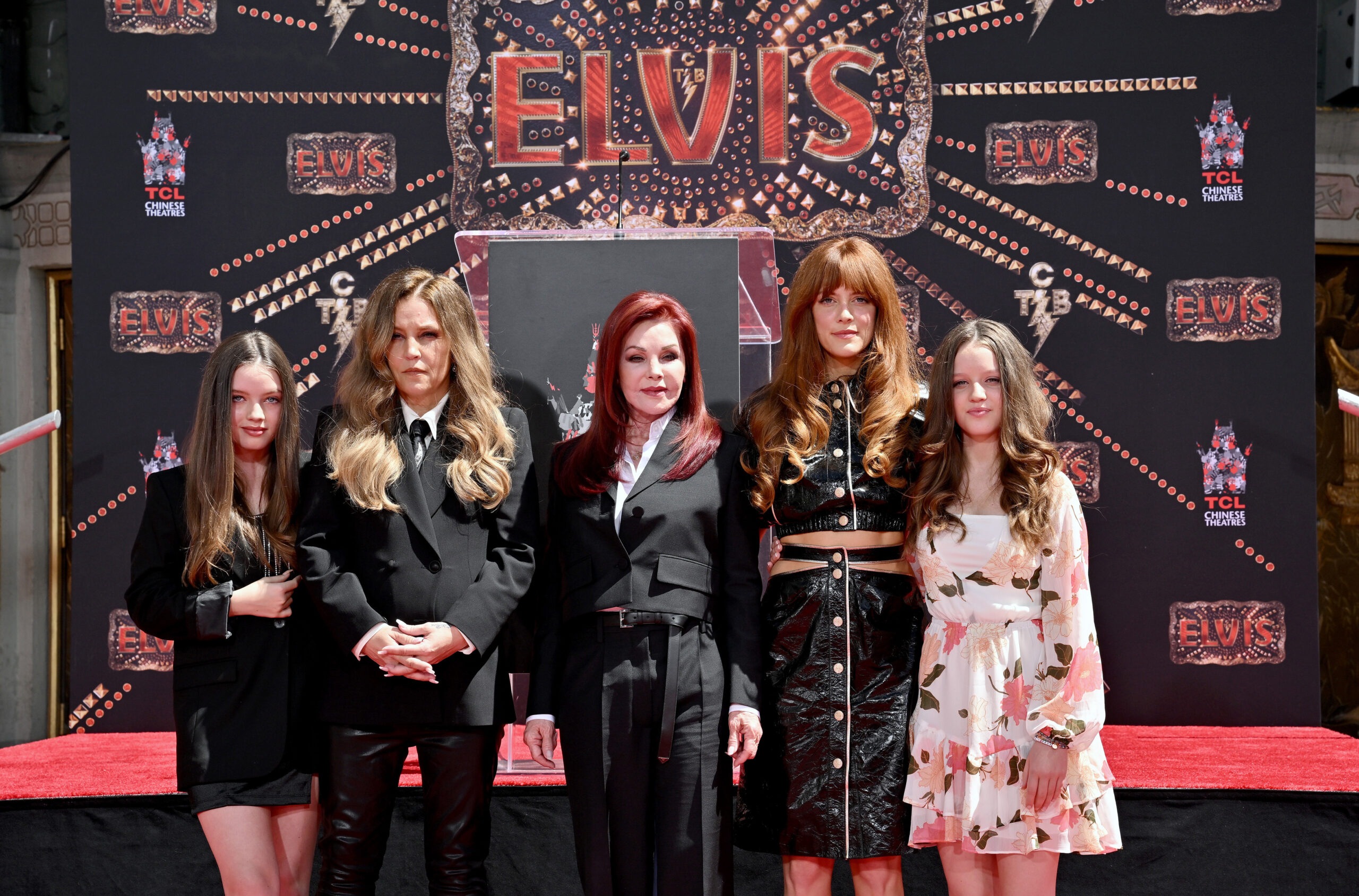HOLLYWOOD, CALIFORNIA - JUNE 21: (L-R) Harper Vivienne Ann Lockwood, Lisa Marie Presley, Priscilla Presley, Riley Keough, and Finley Aaron Love Lockwood attend the Handprint Ceremony honoring Three Generations of Presley's at TCL Chinese Theatre on June 21, 2022 in Hollywood, California. 