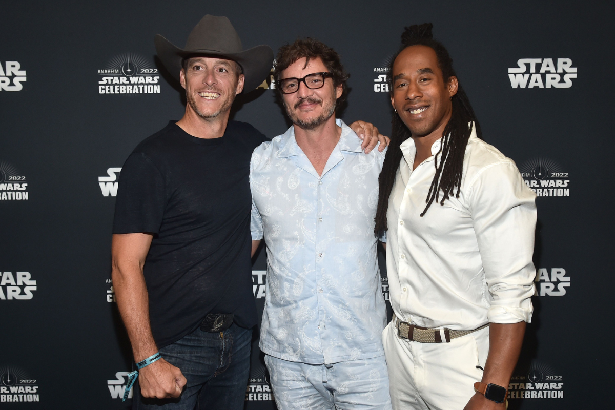 L-R) Brendan Wayne, Pedro Pascal, and Lateef Crowder attend the panel for “The Mandalorian” series at Star Wars Celebration in Anaheim, California on May 28, 2022.