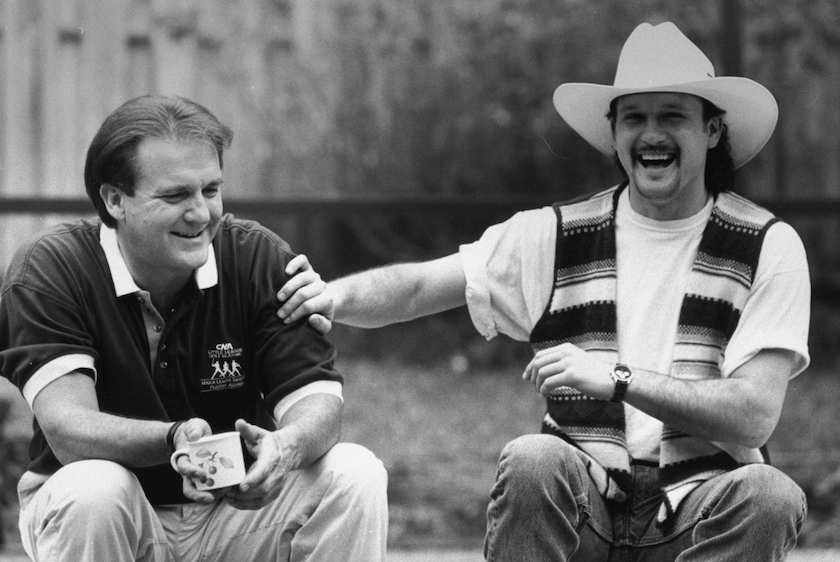 Tim McGraw w. father, former baseball player Tug McGraw, as they sit outside nr. his home. 