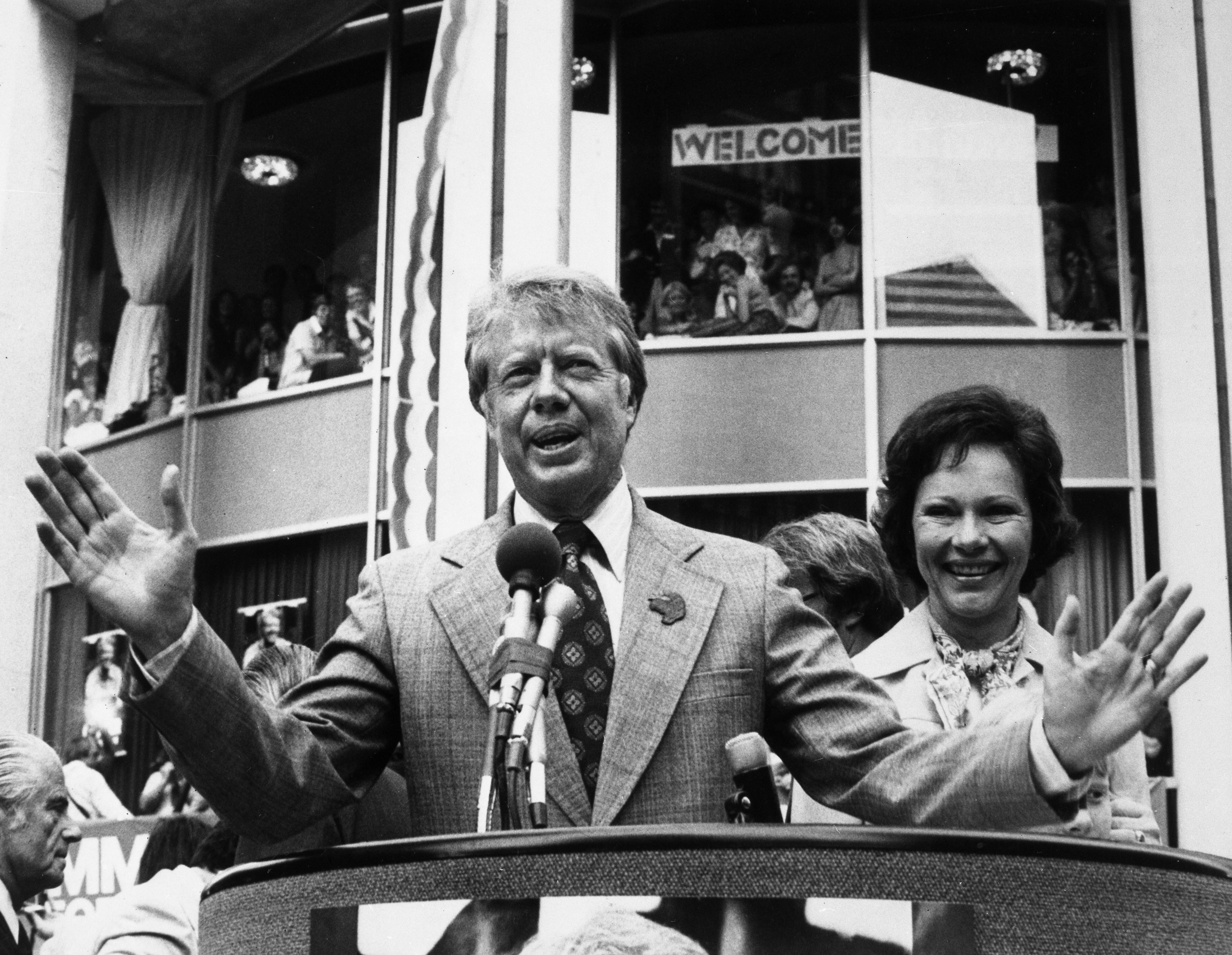Jimmy Carter and his wife, Rosalynn, who is ready to claim the Democratic Presidential nomination at his party's national convention next week, gets a hero's welcome outside his hotel following his arrival.
