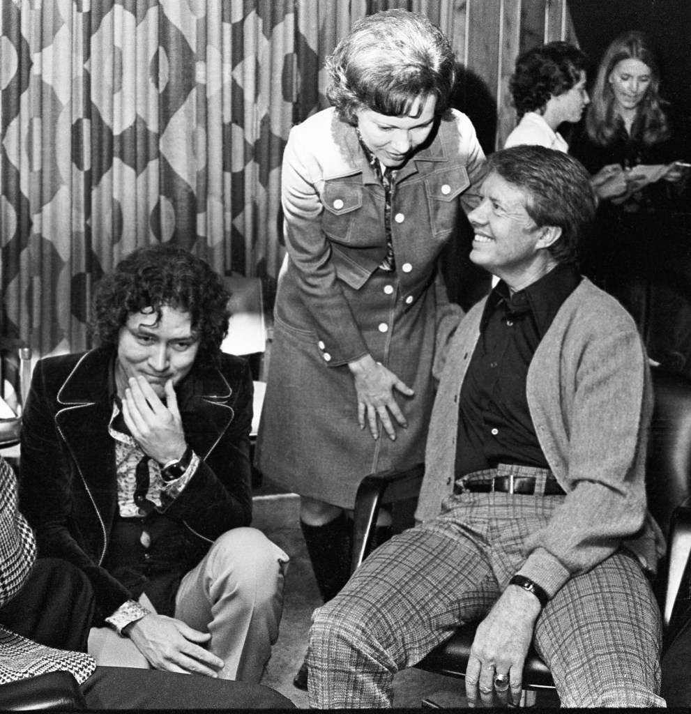 Future POTUS Jimmy Carter visits Capricorn Records during the production of Dickey Betts debut album "Highway Call." (Left to Right) Capricorn Records Co-Founder Phil Walden, First Lady of Georgia Rosalynn Carter and Georgia Governor Jimmy Carter. Circa 1974 