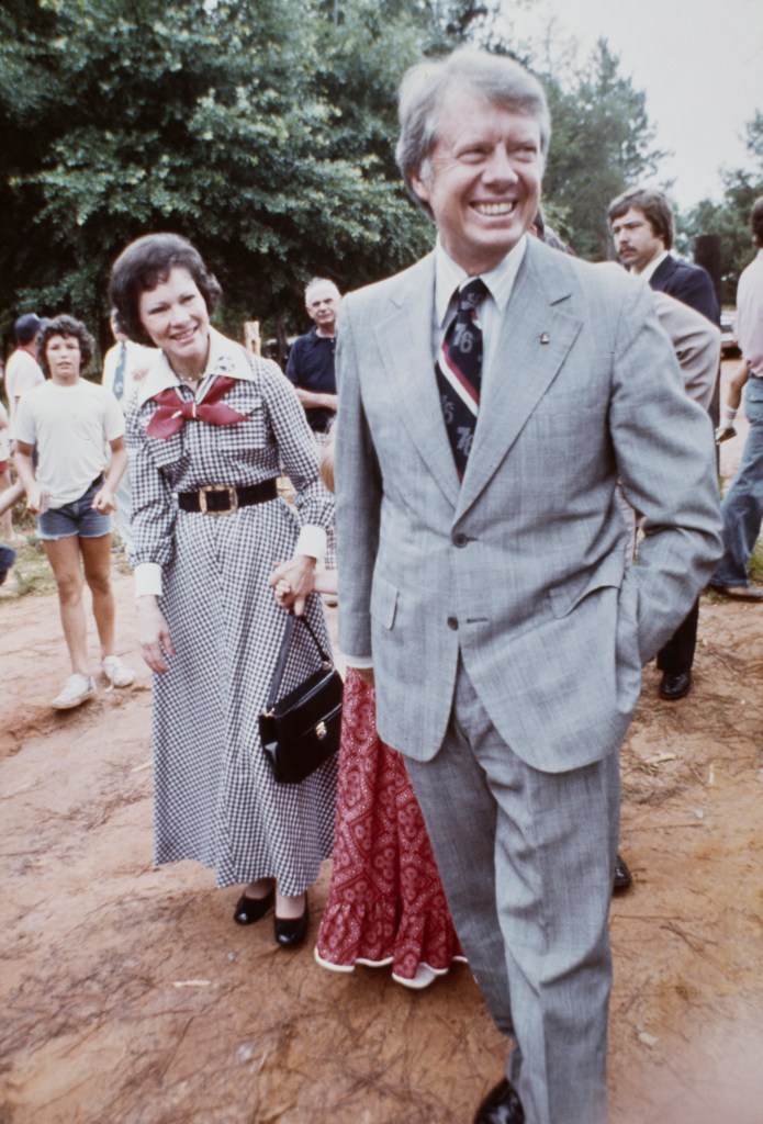 Democratic presidential candidate Jimmy Carter and his wife Rosalynn walk with daughter Amy (partially hidden) as they spend the July 4th holiday weekend at the family home in Plains, Georgia, July 9th 1976. (