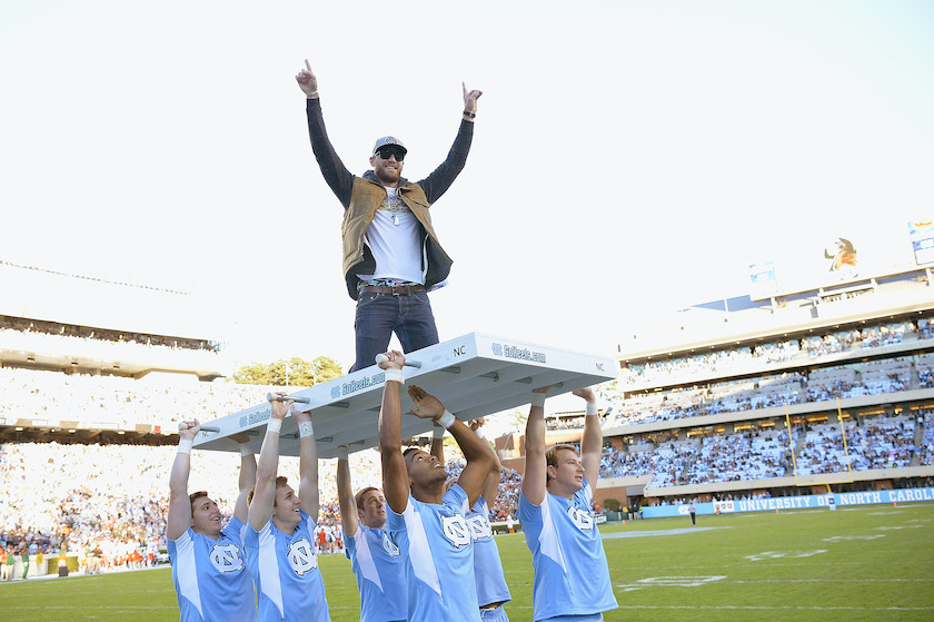 Miami v North Carolina CHAPEL HILL, NC - NOVEMBER 14: Country music performer and former North Carolina Tar Heels football player Chase Rice does pushups during their game against the Miami Hurricanes at Kenan Stadium on November 14, 2015 in Chapel Hill, North Carolina. North Carolina won 59-21. 