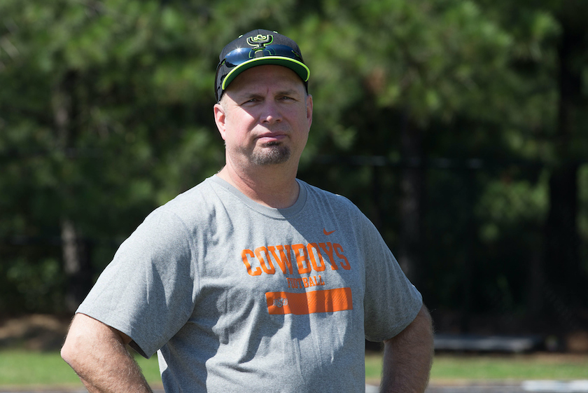 September 21 2014: Garth Brooks watches some drills during the Roddy White football ProCamp sponsored by Garth Brooks' and Troy Aikman's Teammates for Kids. The camp was held in Roswell, Georgia on Sunday morning. Each city where Garth Brooks appears on his world tour will have a Teammates for Kids sponsored ProCamp event. 