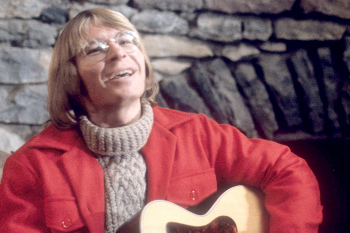 American singer-songwriter John Denver plays his guitar circa 1980's.