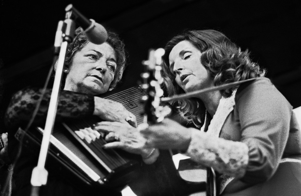 Maybelle Carter, left, playing her autoharp, performs with her daughter, Helen, at the A.P. Carter Memorial Festival in Maces Springs, Virginia, in August 1977. A.P. Carter was the leader of the seminal singing group, the Carter Family (A.P., his wife Sara and his cousin Maybelle Carter), whose recordings in the 1920s and 1930s launched America's country music industry. Johnny Cash was married to June Carter, daughter of Maybelle Carter.