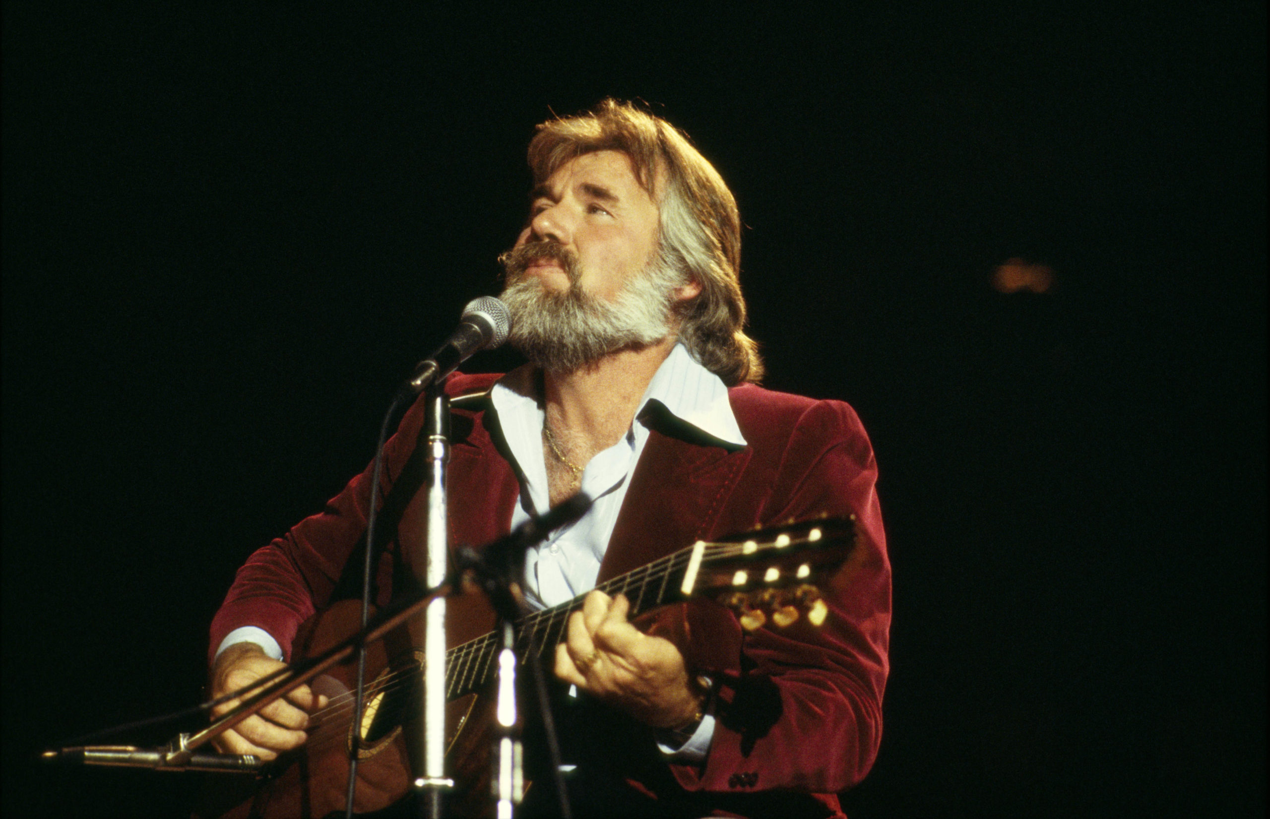 Kenny Rogers performing on stage, 1978. (