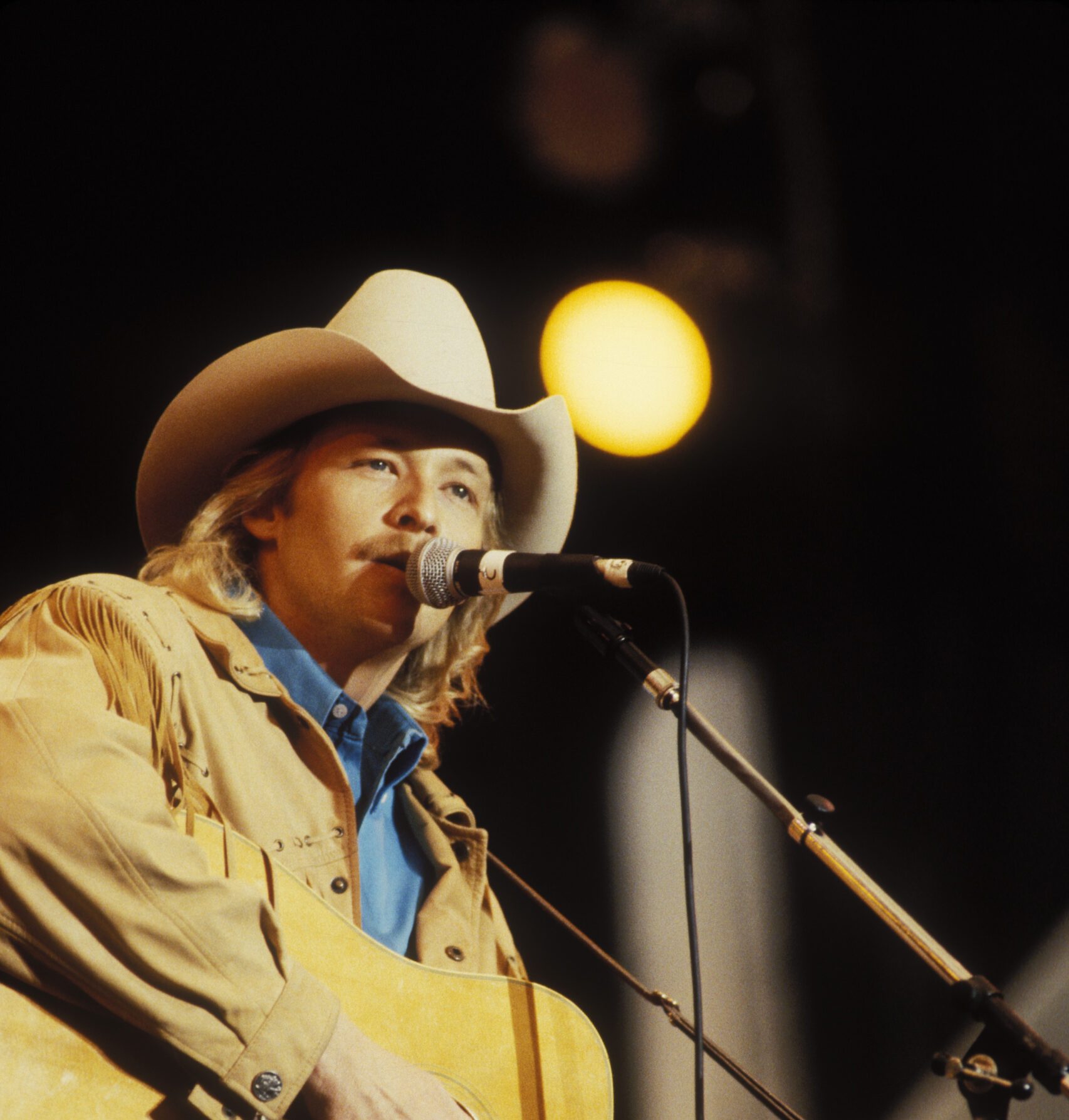 Photo of Alan JACKSON; Alan Jackson performing at Farm Aid in Indianapolis, Indiana on April 7, 1990