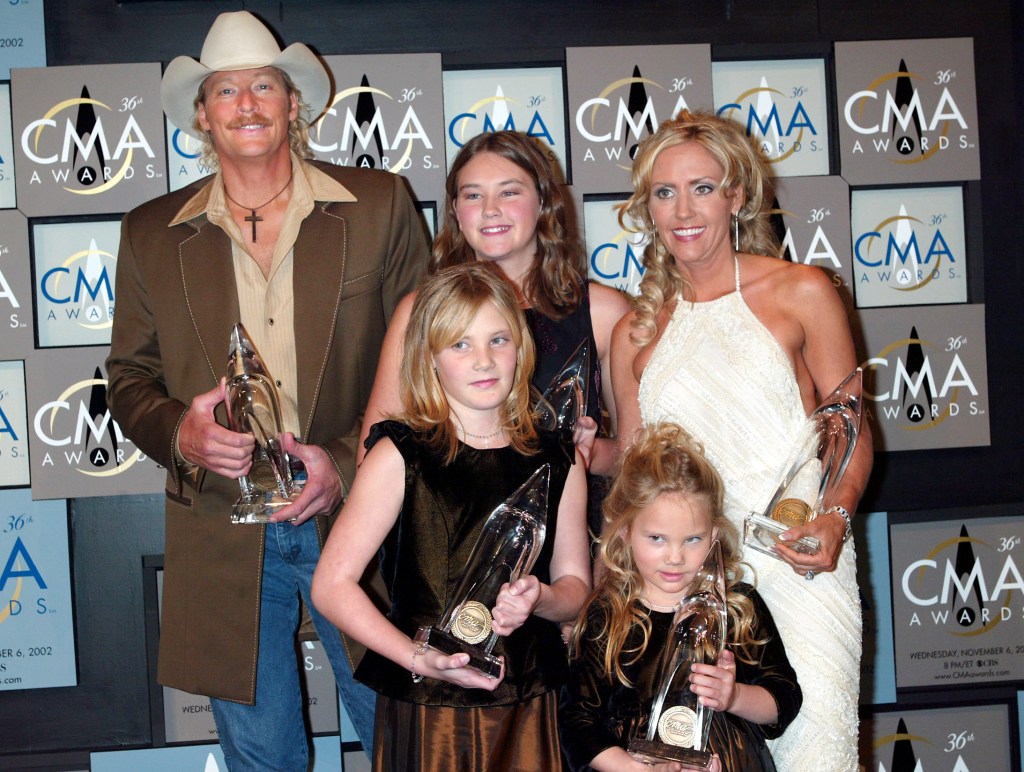 Alan Jackson poses with his 5 awards with a little help from his family- wife Denise, and Daughters Mattie- 12, Ali-9, and Dani-5, at the 36th annual Country Music Association Awards at the Grand Ole Opry House in Nashville, Tennessee, November 6, 2002.  Photo by Scott Gries/Getty Images