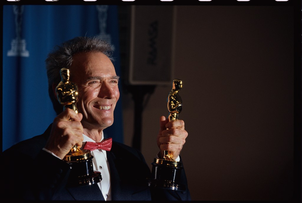 Clint Eastwood holds his Oscars at the 65th Academy Awards Ceremony.