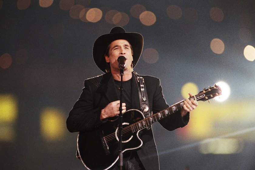 ATLANTA, GA - 1994: Country singer Clint Black performs during the half-time show at the 1994 Atlanta, Georgia, Superbowl XXVII football game at the Georgia Dome.
