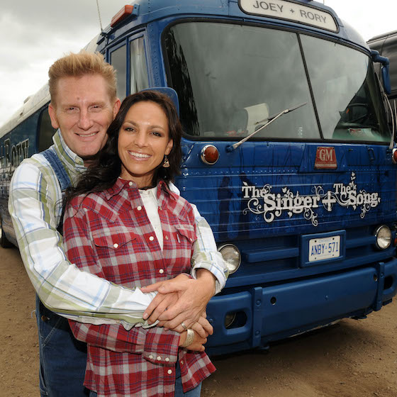TWIN LAKES, WI - JULY 18: ***EXCLUSIVE COVERAGE*** Joey Martin Feek and Rory Lee Feek (L) of singer/Songwriter duo Joey + Rory pose by their 1955 tour bus backstage at the 17th Annual Country Thunder USA music festival on July 18, 2009 in Twin Lakes, Wisconsin.