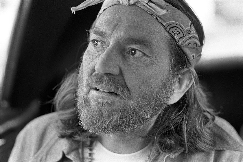 Willie Nelson, promoting his record "Red Headed Stranger", appeared at Peaches Records to leave his footprints in concrete.