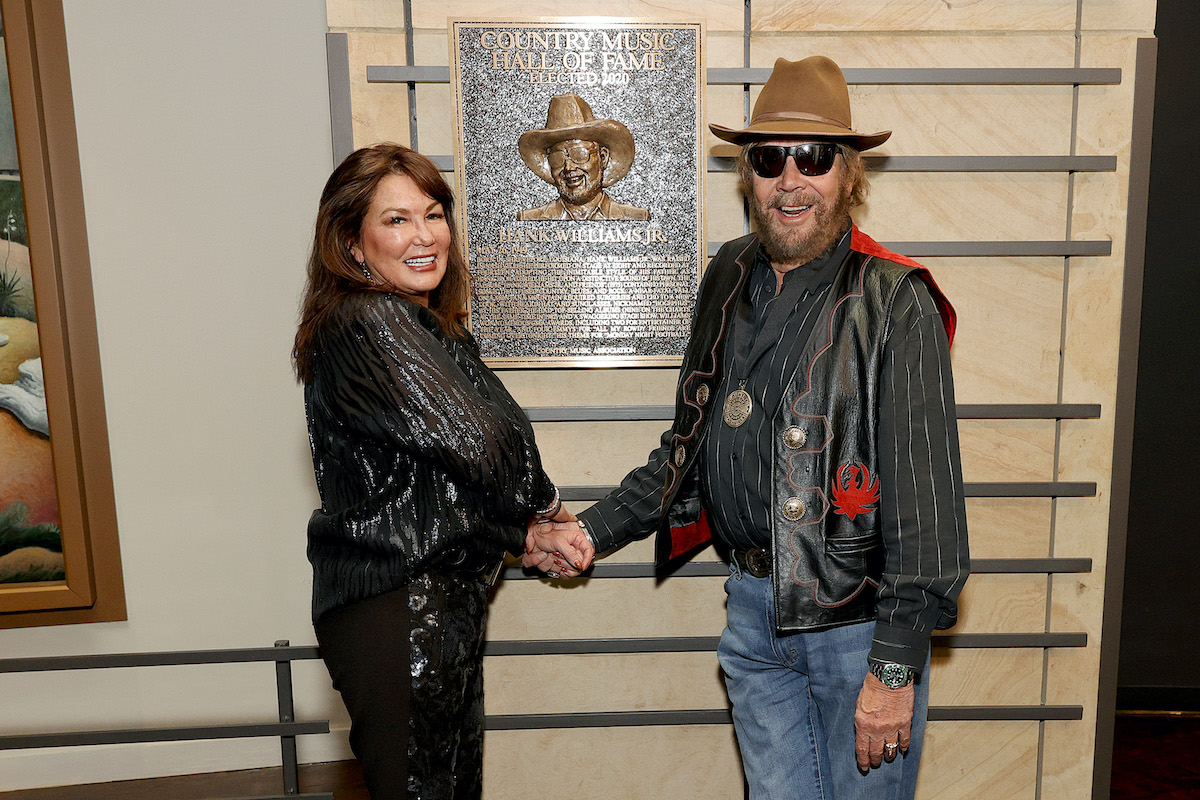 Mary Jane Thomas and 2020 inductee Hank Williams Jr. seen during the 2021 Medallion Ceremony, celebrating the Induction of the Class of 2020 at Country Music Hall of Fame and Museum on November 21, 2021 in Nashville.