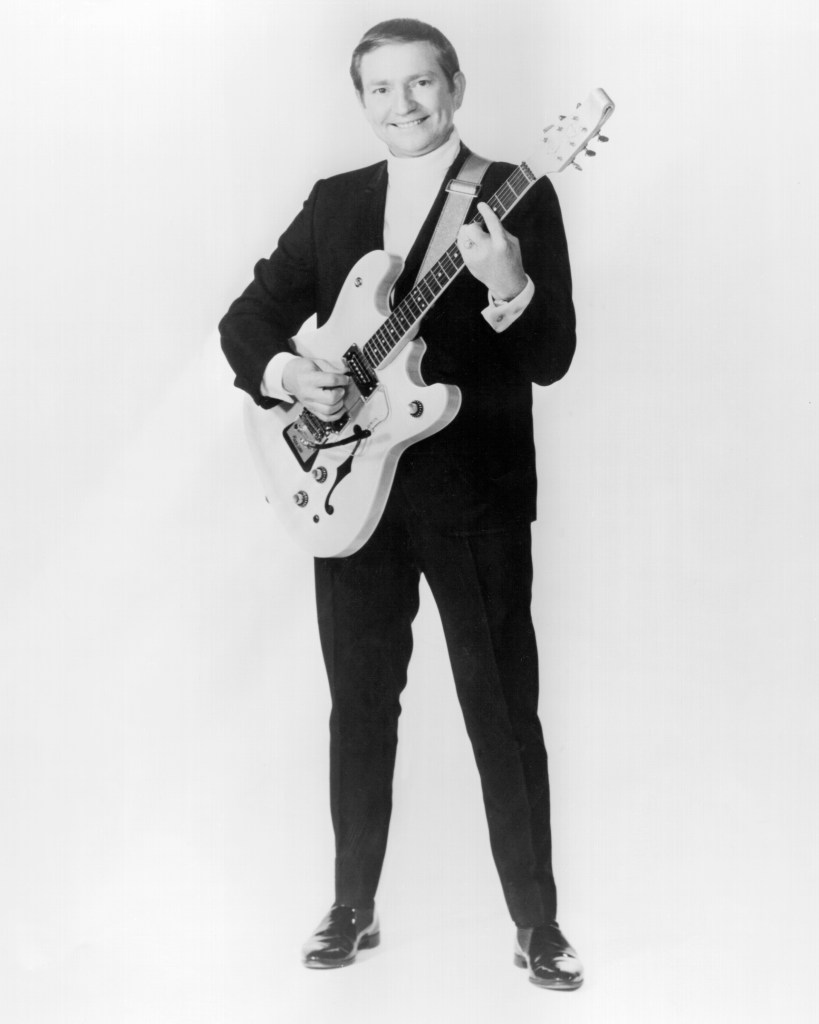 Country singer/songwriter Willie Nelson poses for a portrait holding an electric guitar in circa 1965. 