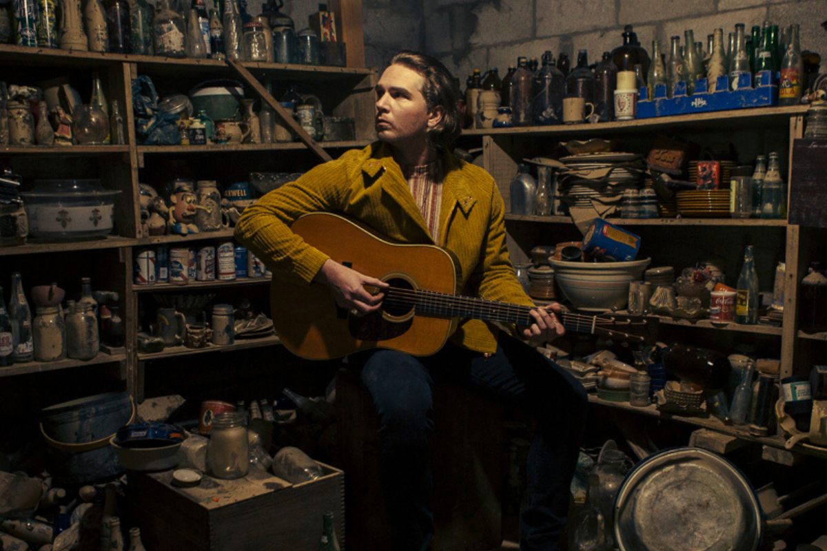 Ian Noe poses with guitar