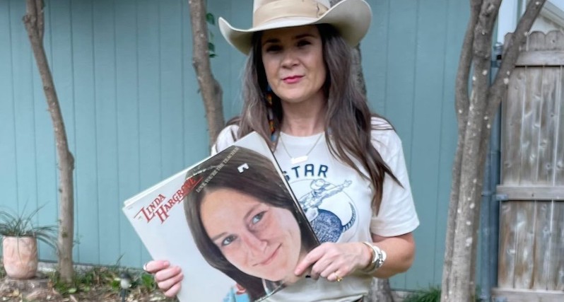 Linda Hargrove booster and fellow singer-songwriter holds a copy of 1975's 'Love, You're the Teacher.'