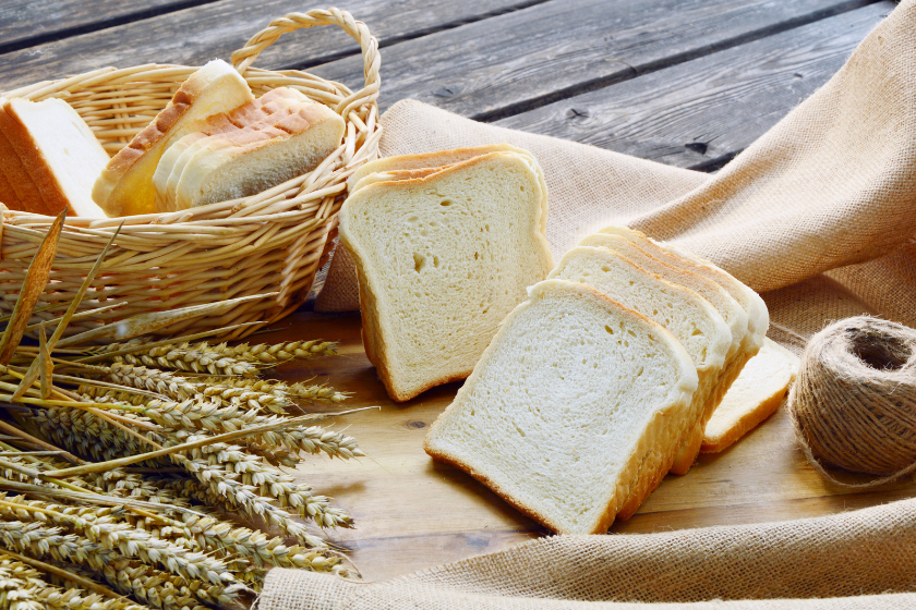 bread and wheat on table