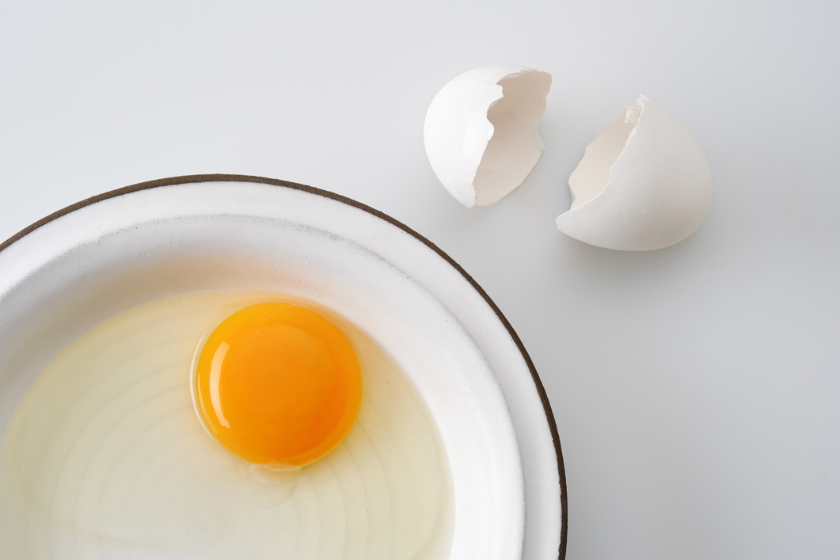 Cracked egg in a bowl