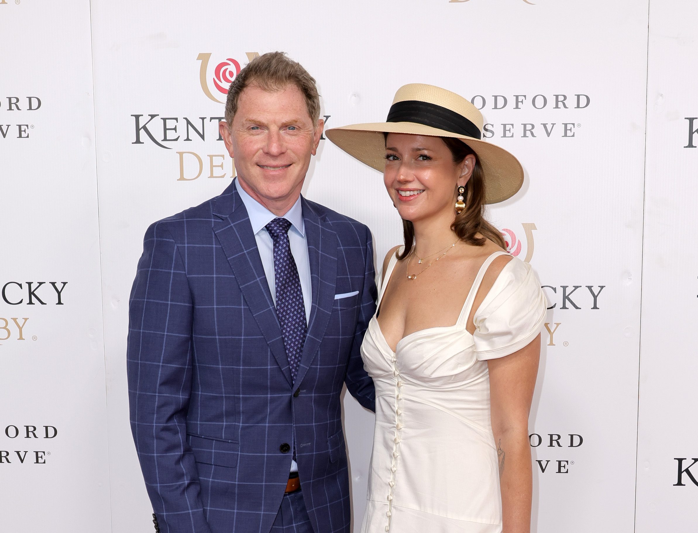 LOUISVILLE, KENTUCKY - MAY 07: Bobby Flay and Christina P&eacute;rez attend the 148th Kentucky Derby at Churchill Downs on May 07, 2022 in Louisville, Kentucky. 