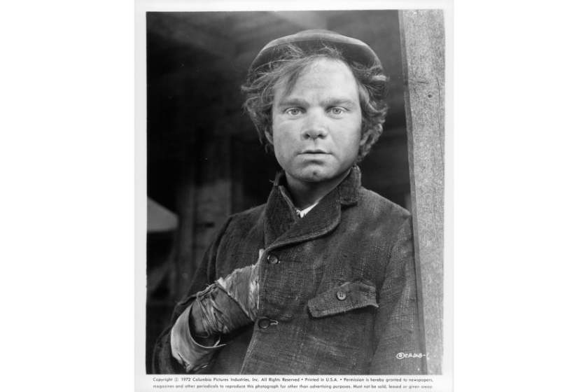 Michael J Pollard with hand is his overcoat in a scene from the film 'Dirty Little Billy', 1972