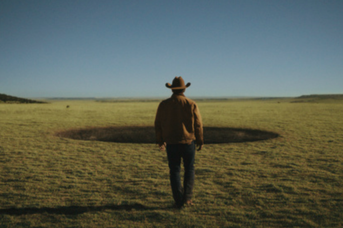 Description: Josh Brolin (Royal Abbott) walking up to a black hole in a scene from 'Outer Range'