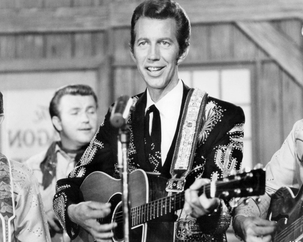 American country music singer Porter Wagoner (1927 - 2007) performing, circa 1960.
