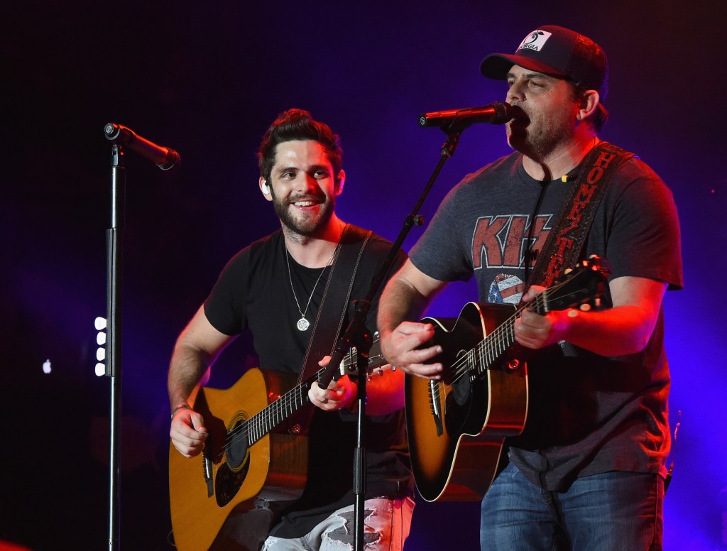 Singer/Songwriter Thomas Rhett is joined on stage by his Dad Singer/Songwriter Rhett Akins during Pepsi's Rock The South Festival - Day 1 at Heritage Park on June 3, 2016 in Cullman, Alabama.