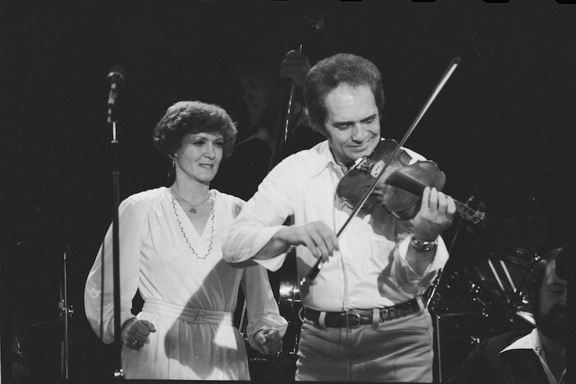Merle Haggard performs at the Headliner Room at Harrah's in Reno. The back-up singer is Haggard's ex-wife Bonnie Owens. 