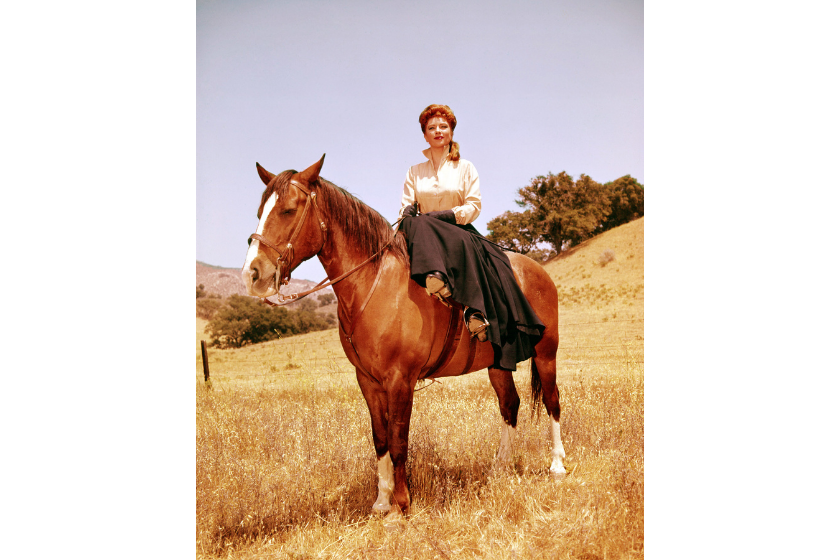 Amanda Blake (1929-1989), US actress, sitting side saddle on horseback in a publicity portrait issued fo the US television series, 'Gunsmoke', USA, circa 1955. The Western series starred Blake as 'Kitty Russell'.