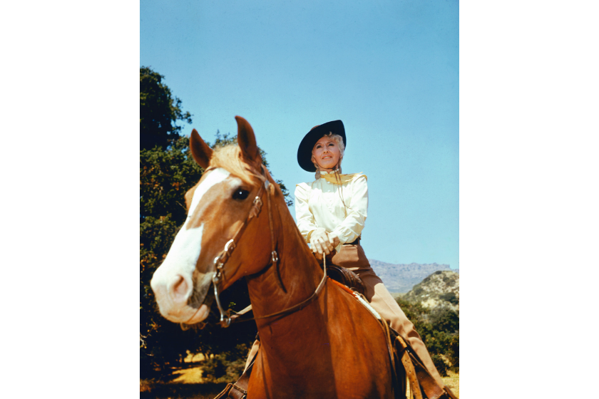 Barbara Stanwyck (1907-1990), US actress, on horseback in a publicity portrait issued for the US television series, 'The Big Valley', USA, circa 1965. The series, set on the Barkley Ranch in San Joaquin Valley, California, starred Stanwyck as 'Victoria Barkley'