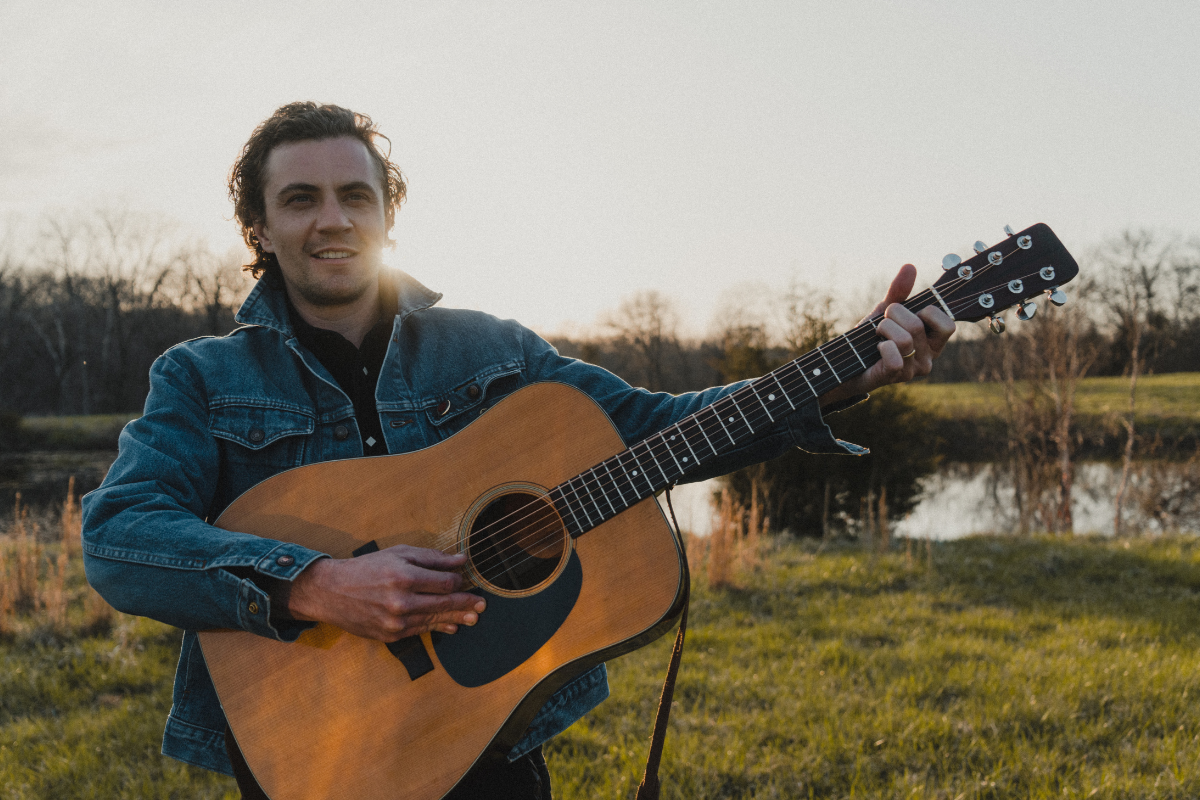 Forrest McCurren poses with guitar