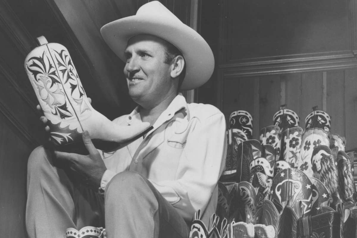 American singer and actor Gene Autry with his collection of cowboy boots. (Photo by Hulton Archive/Getty Images)