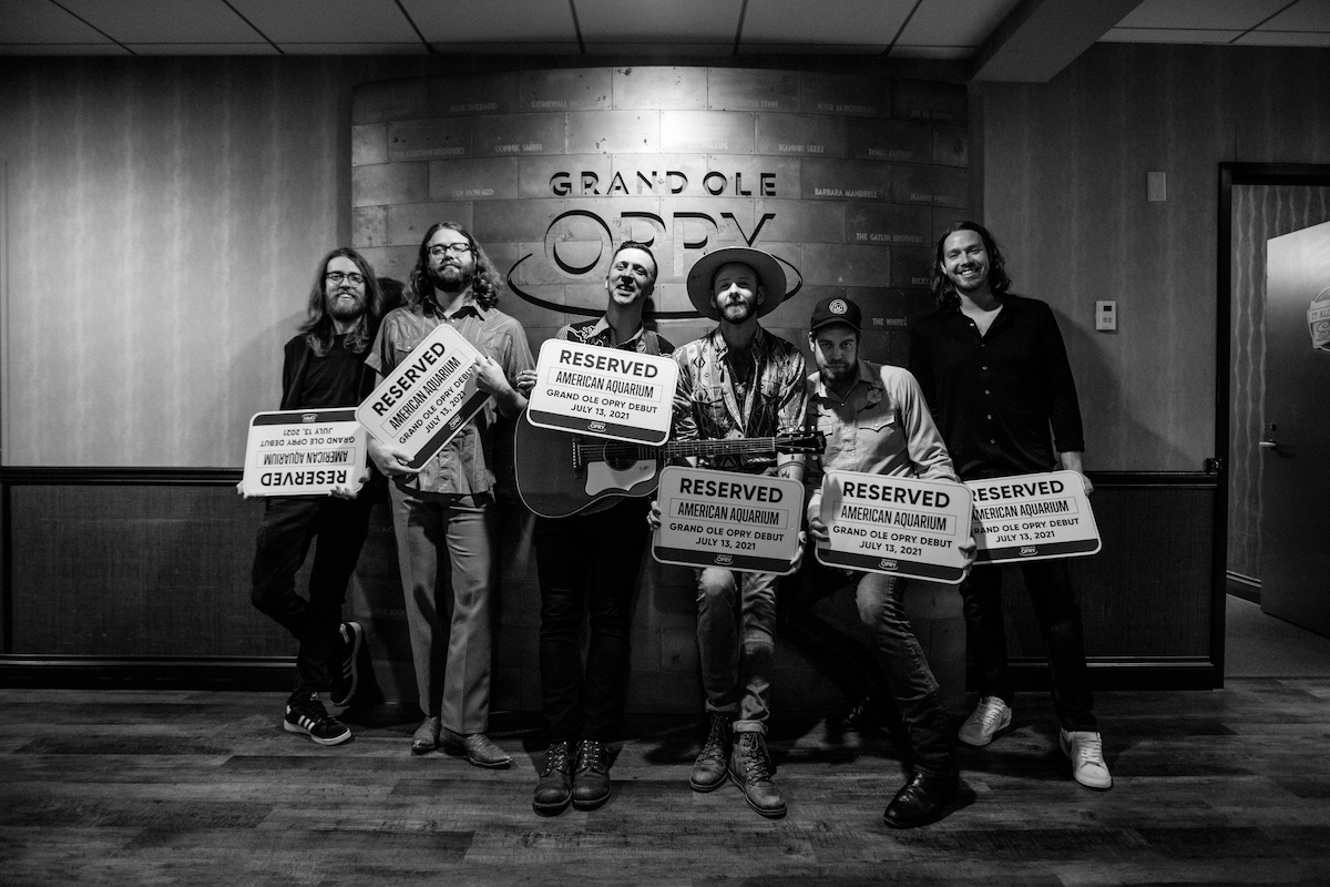 Members of American Aquarium took home their VIP parking signs from their July 2021 Opry debut.