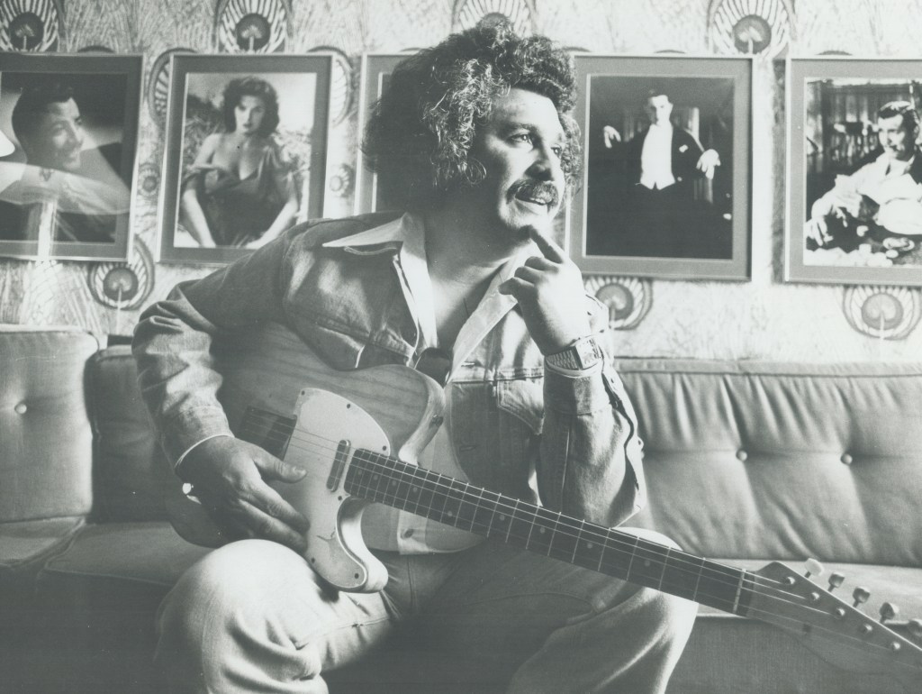 Freddy Fender poses backstage