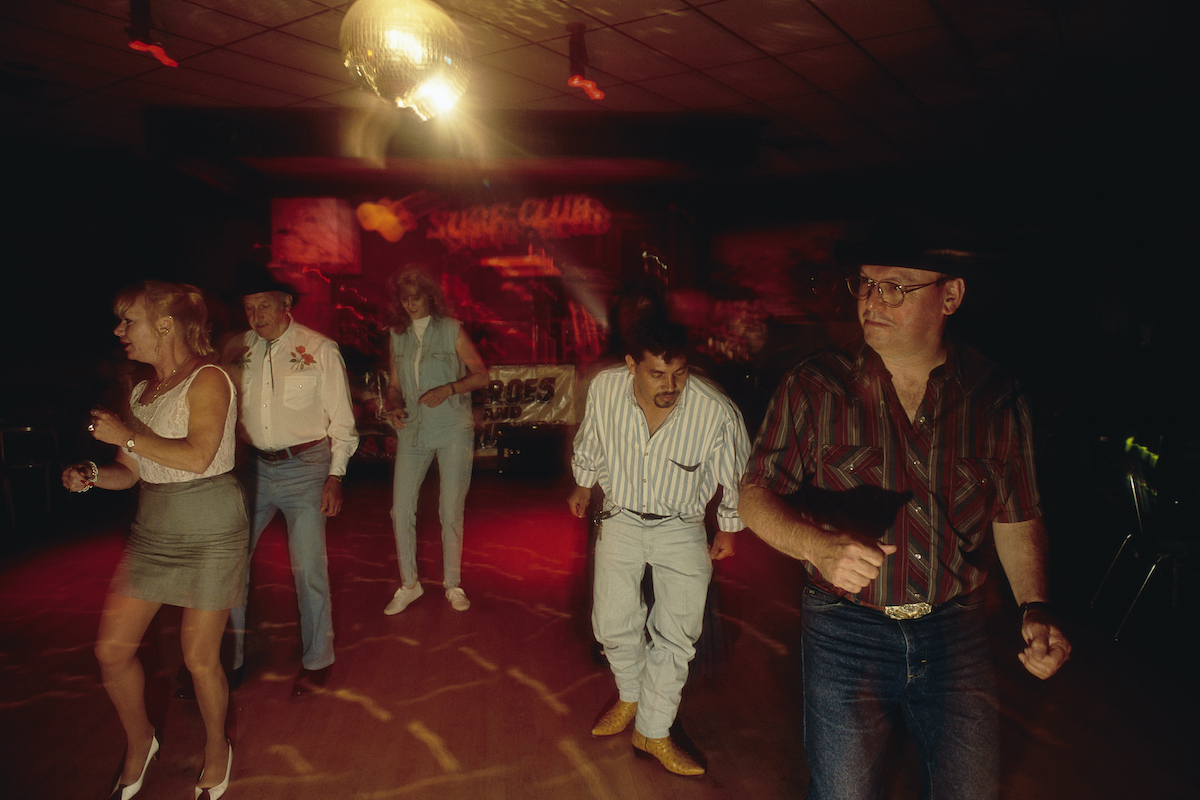 People line dance at Chick Hall's Surf Club, a honky-tonk nightclub in Bladensburg, Maryland which opened in 1955.